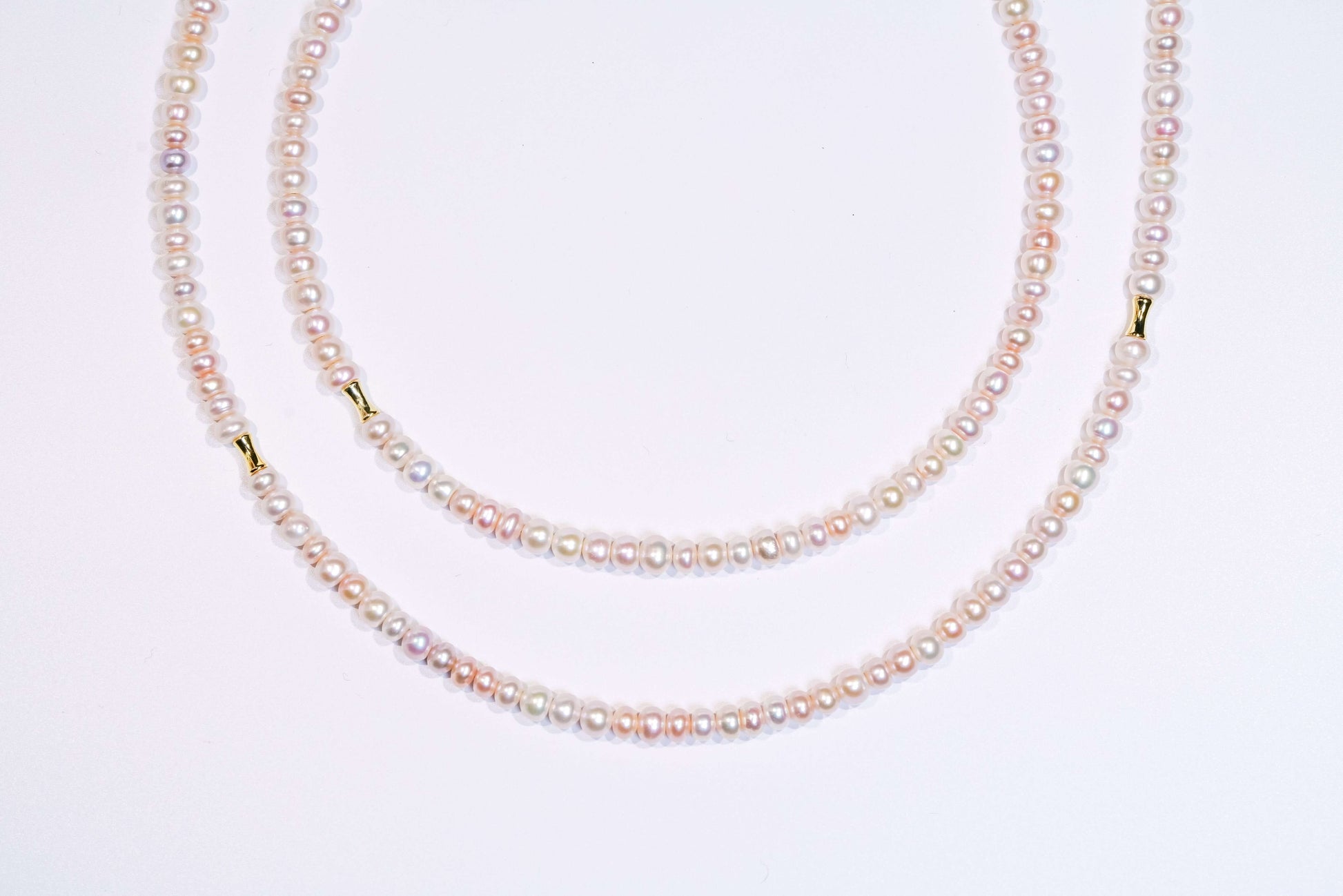 Candy pearl cross-body phone strap necklace with natural pearls and silver accents, stylish and vibrant.