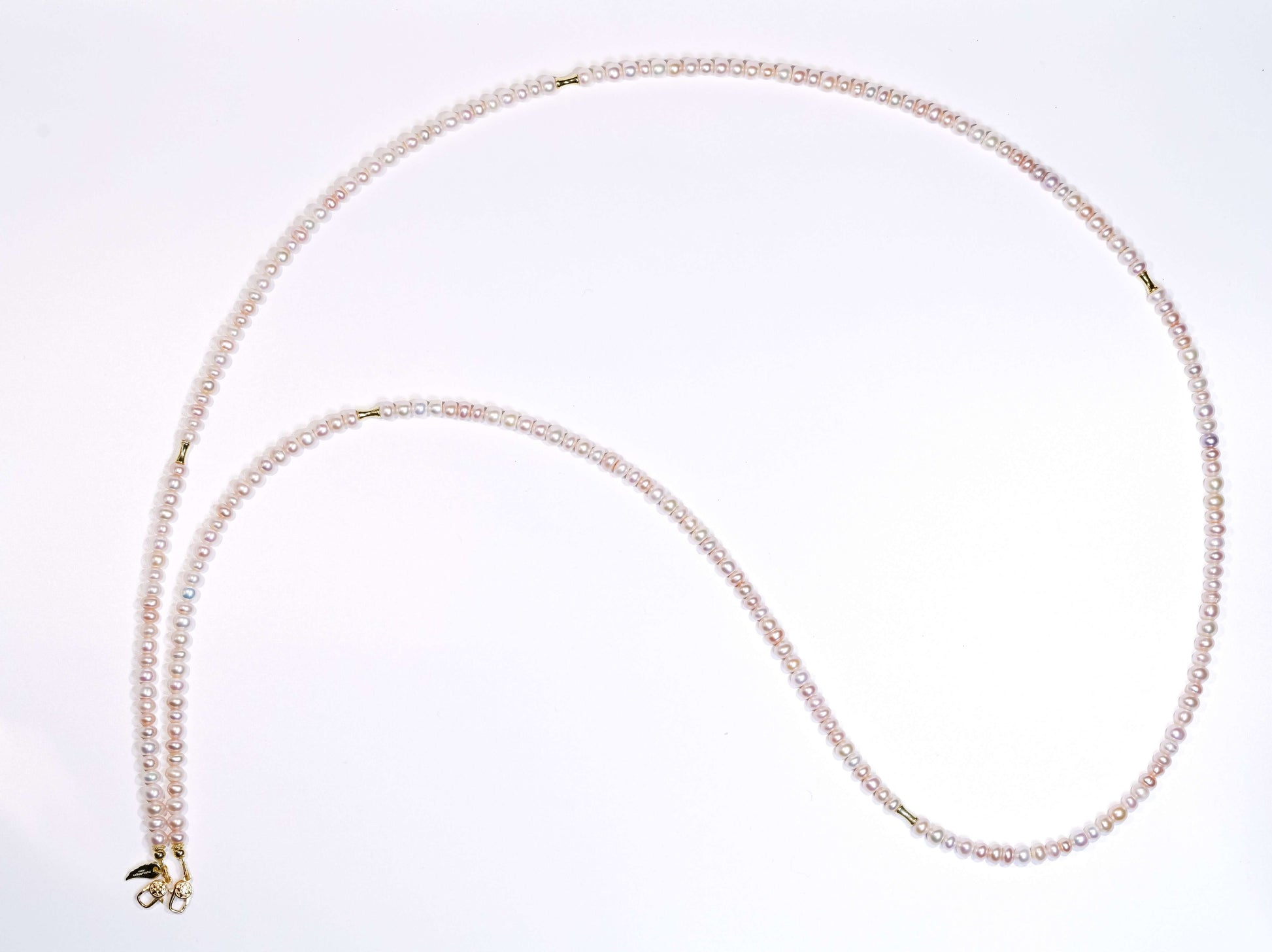 Candy pearl cross-body phone strap and necklace with silver accents, showcasing a unique fashion appeal.