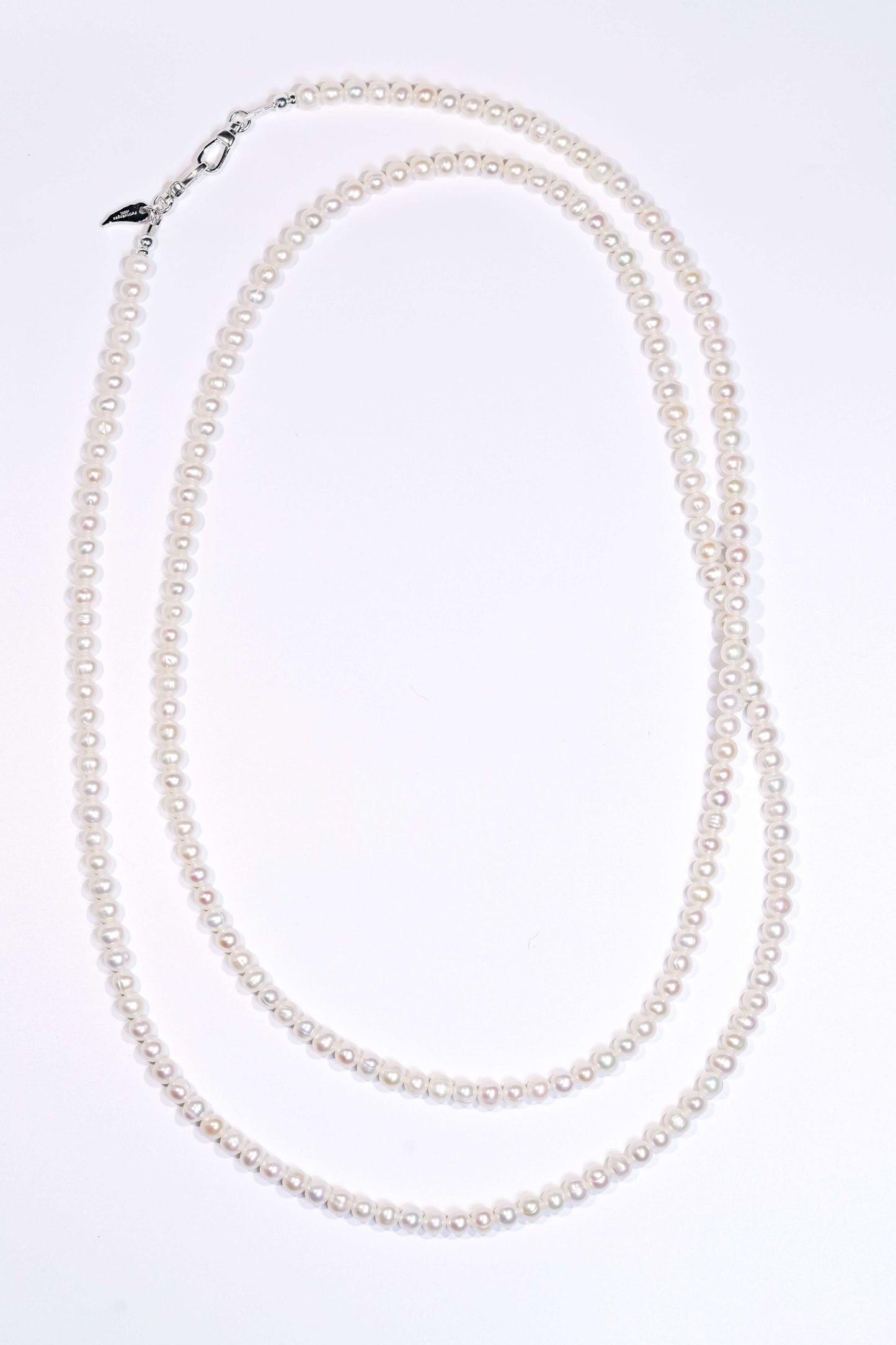 Classic natural pearl cross-body phone strap and necklace, showcasing elegant luster and versatile design.