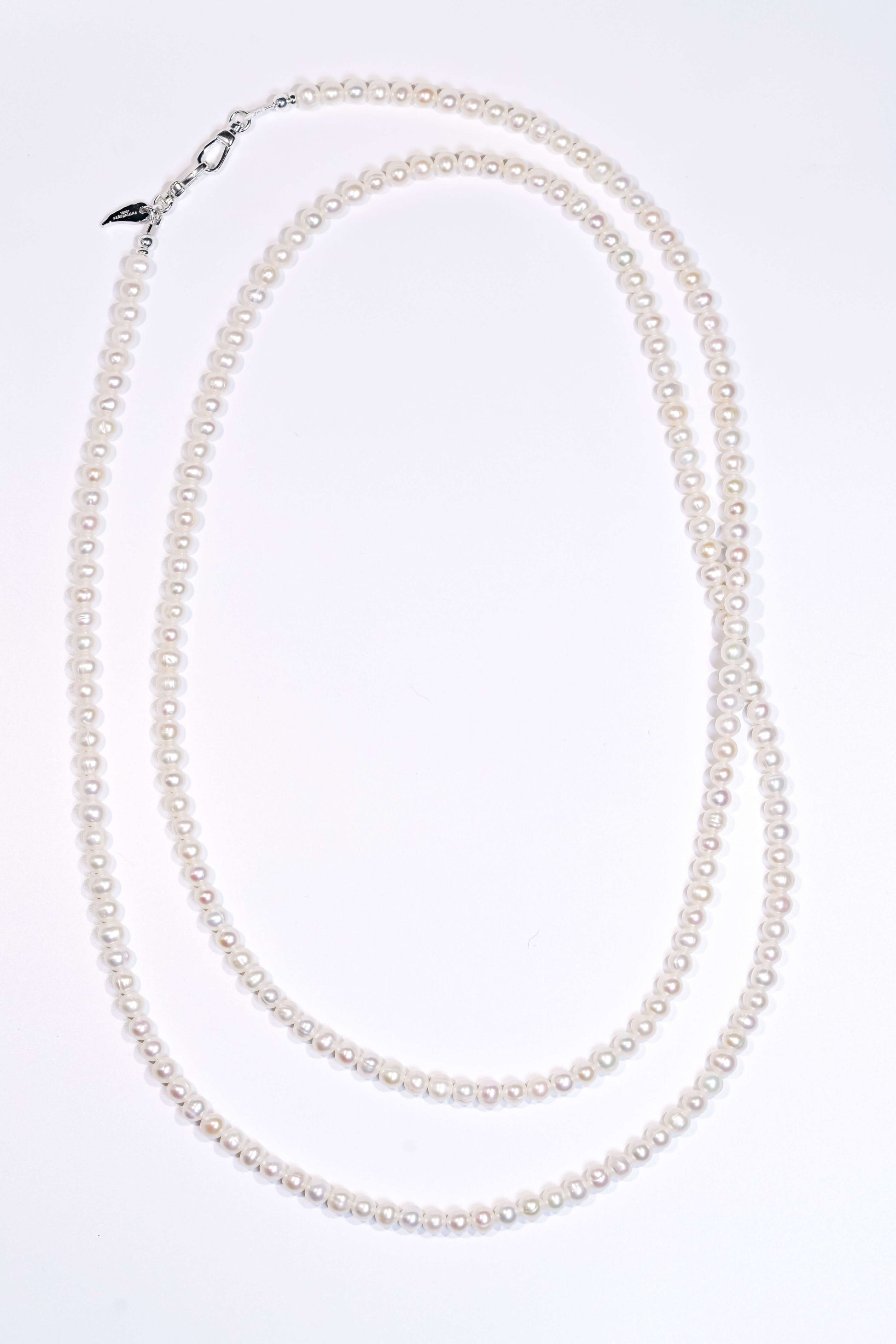 Classic natural pearl cross-body phone strap and necklace, showcasing elegant luster and versatile design.