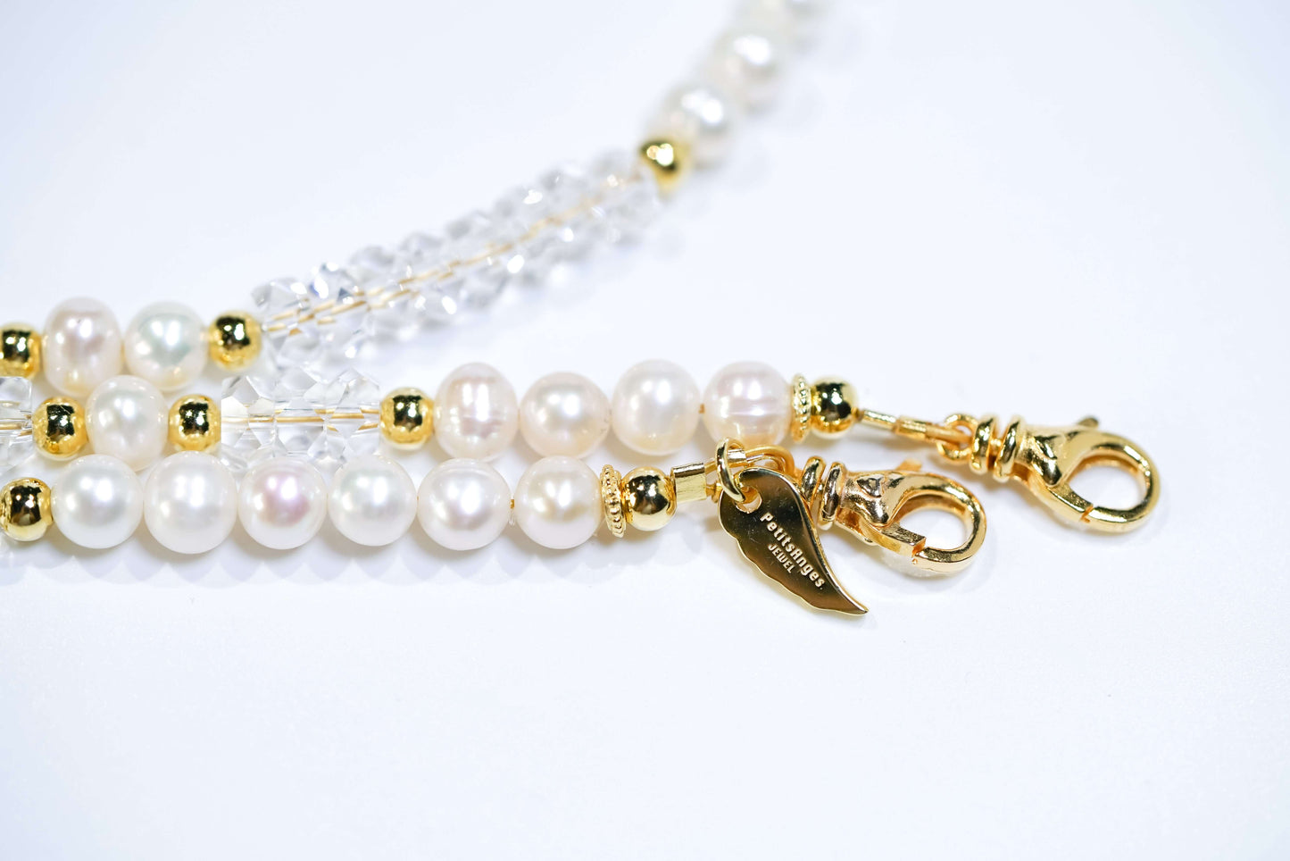 Elegant Pearl-White Crystal Cross-body Phone Strap/ Necklace with gold accents and unique clasp.