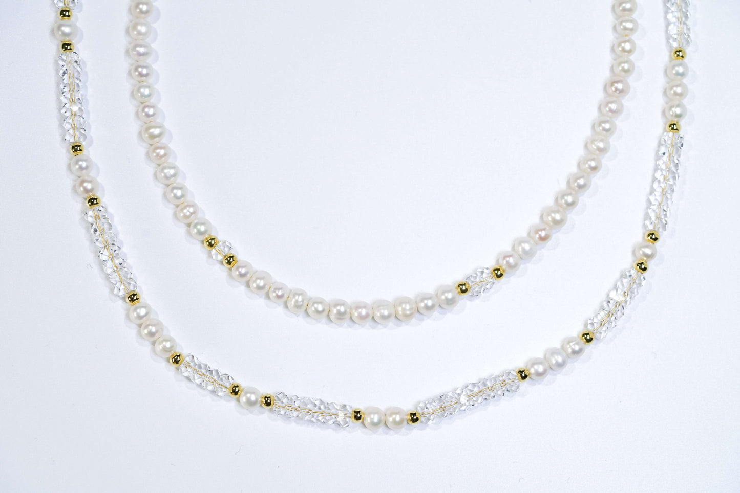 Elegant Pearl-White Crystal Cross-body Phone Strap/ Necklace with gold accents, showcasing smooth lines and handcrafted design.