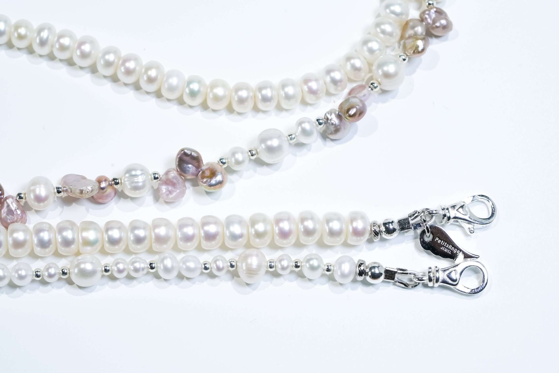 Close-up of White Pearl-Petal Purple Pearl Phone Strap/Necklace made with natural pearls and S925 silver hardware.