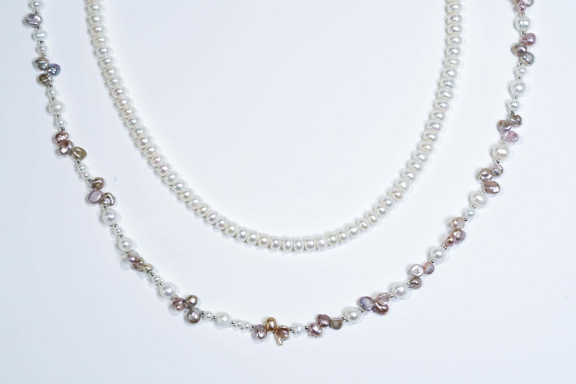 White Pearl-Petal Purple Pearl Phone Strap/Necklace displayed elegantly, showcasing natural pearls and unique design.