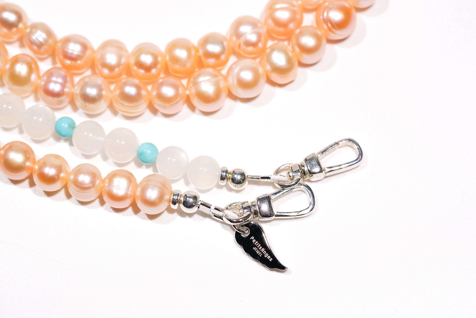 Pearl moonstone turquoise cross-body phone strap with blush pink pearls, moonstone, turquoise, and S925 silver hardware.