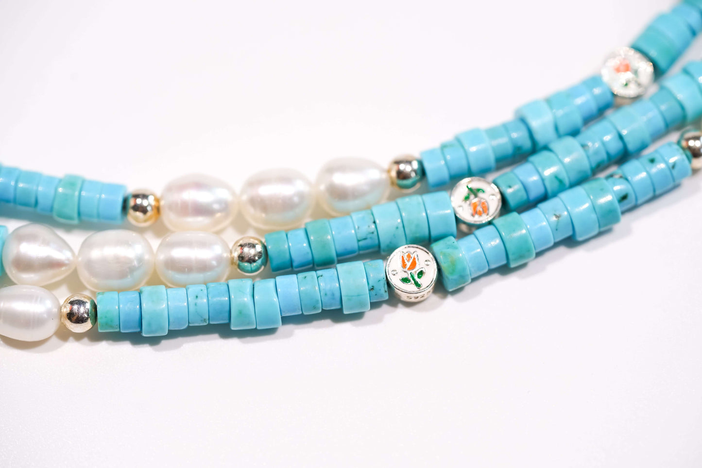 Pearl and turquoise cross-body phone strap with S925 silver hardware, featuring freshwater oval pearls and turquoise beads.