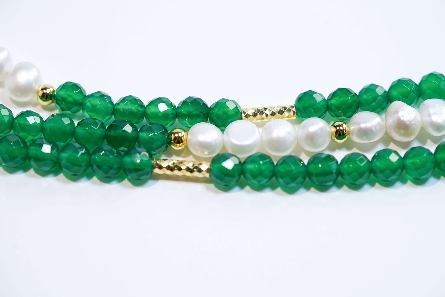 Elegant baroque pearl and green agate beaded phone strap with gold accents showcasing luxury and style.