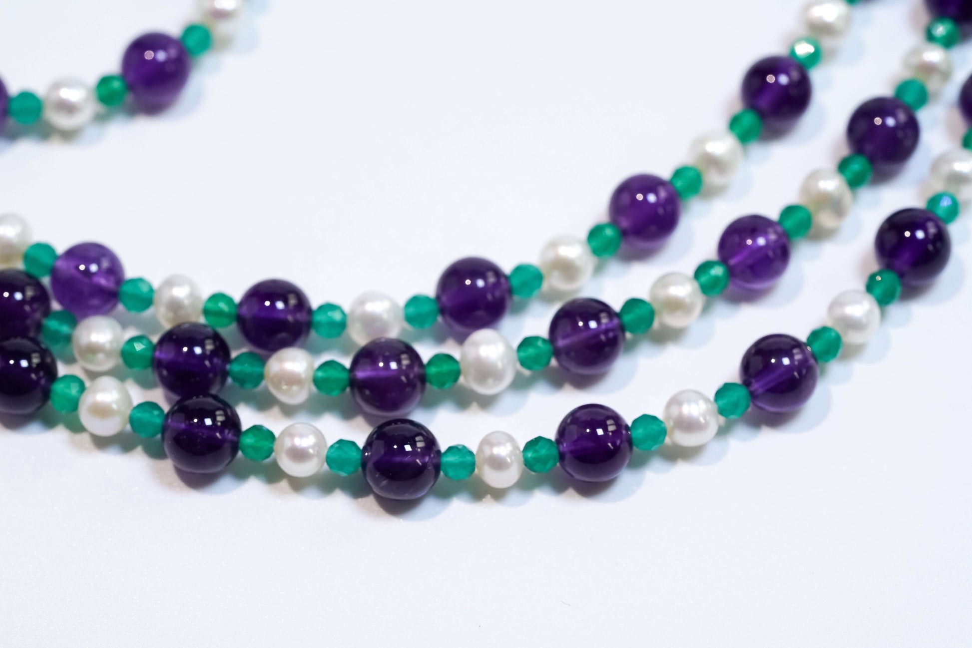 Cross-body phone strap with natural pearls, green agate, and amethyst beads featuring S925 silver hardware.