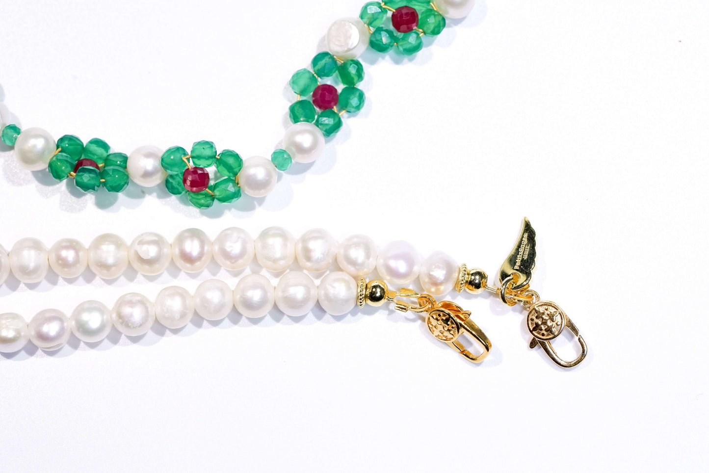 Pearl-green agate cross-body necklace with gold accents, featuring natural pearls and colorful hand-woven flowers.