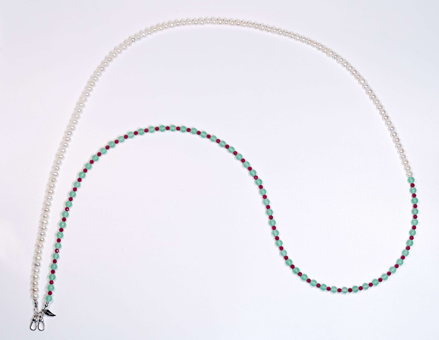 Cross-body phone strap/necklace made of natural pearls, aventurine, and ruby accents, showcasing a stylish 2-in-1 design.