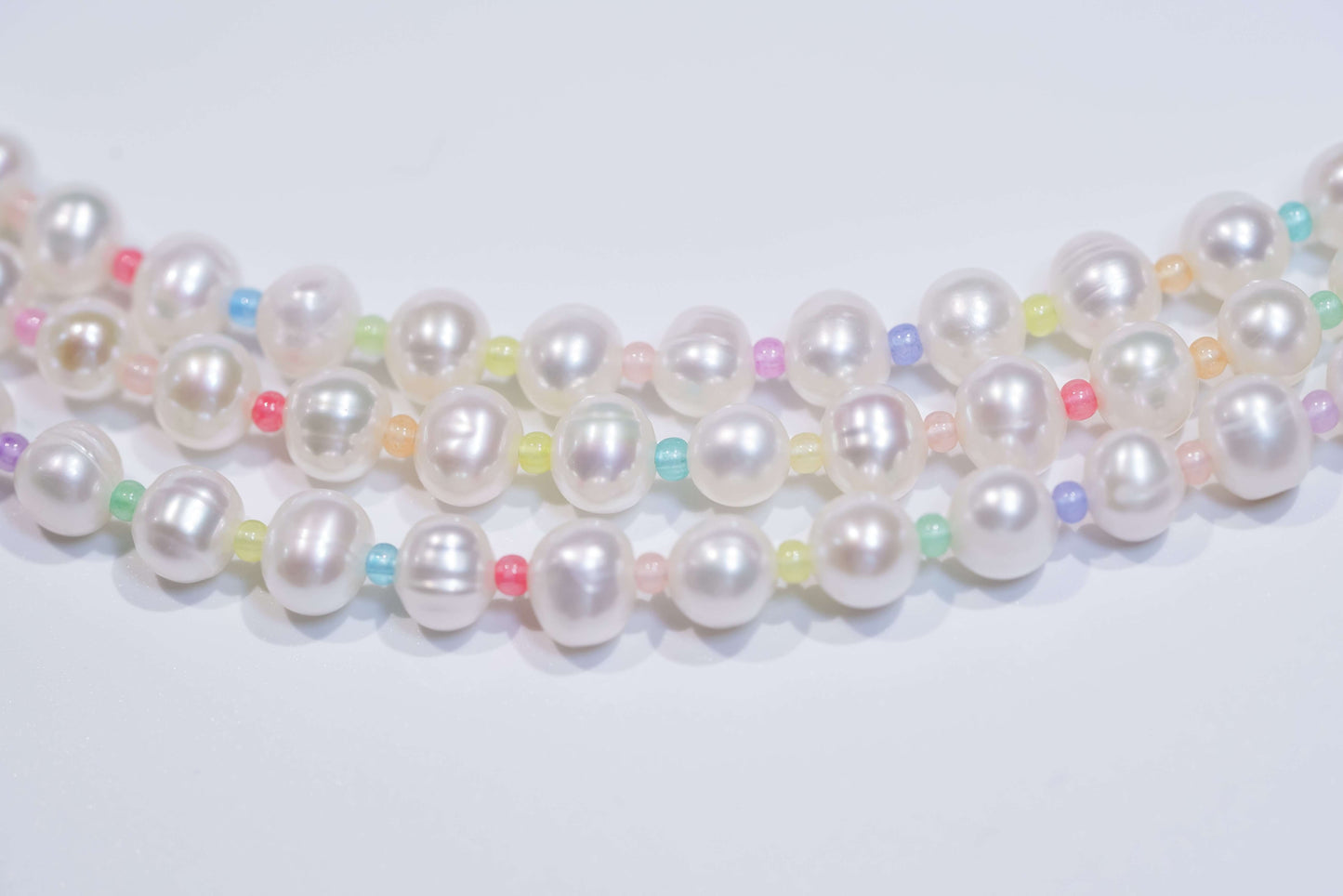 Pearl-glass beads cross-body phone strap/necklace showcasing natural white pearls and colorful glass accents.