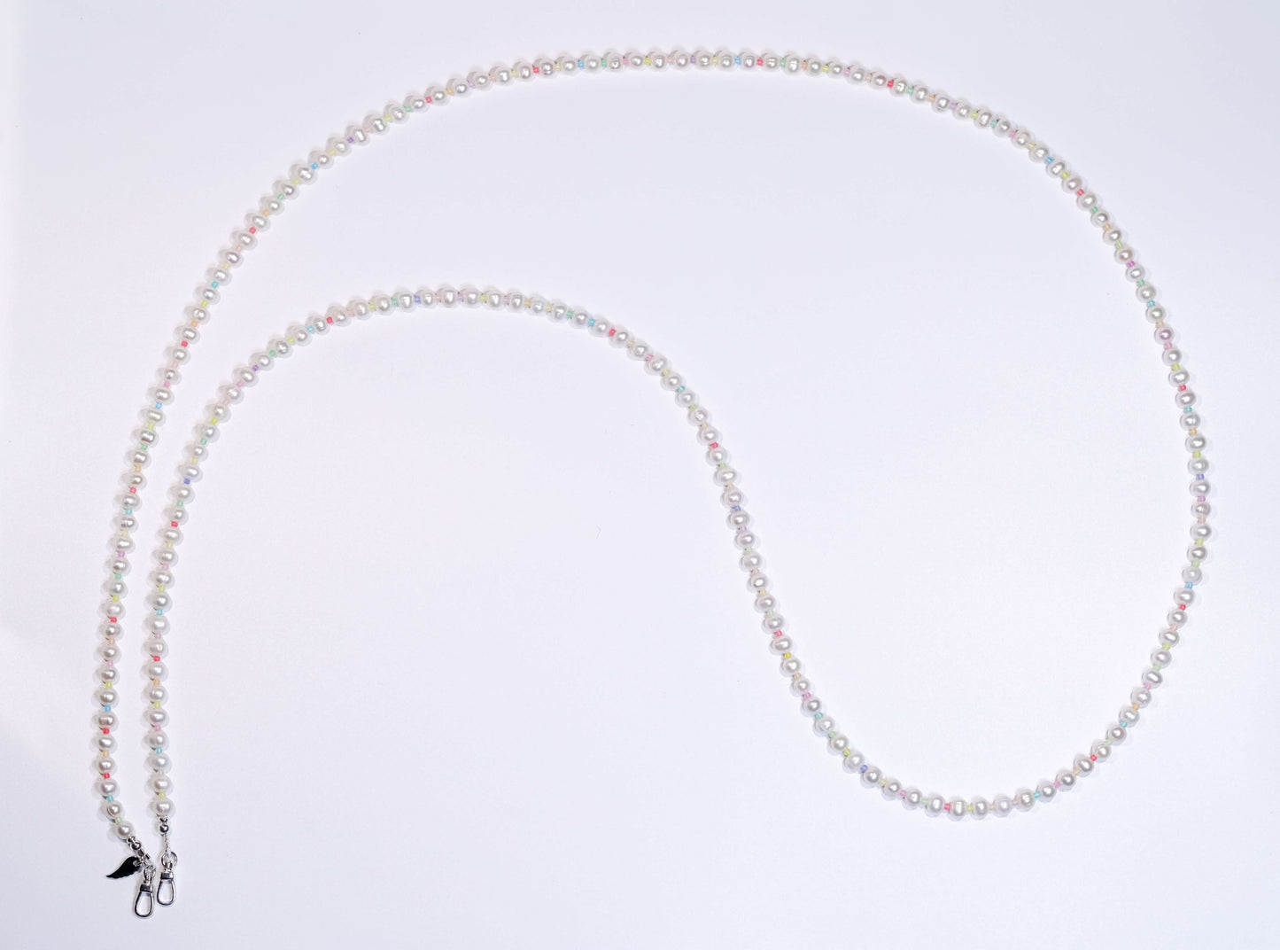 Cross-body phone strap necklace featuring natural white pearls and colorful glass beads, with sterling silver accents.